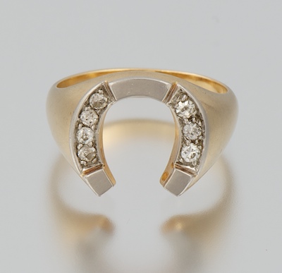 A Ladies' Diamond Horseshoe Ring