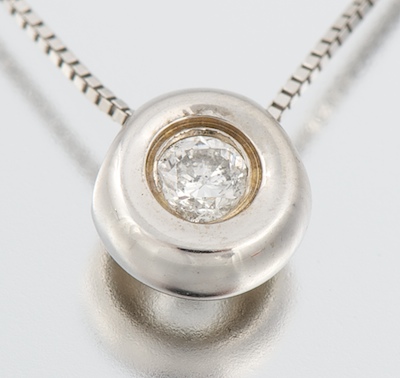 A Ladies Dainty Diamond Pendant on