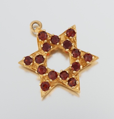 A Gold and Garnet Star of David 13419e