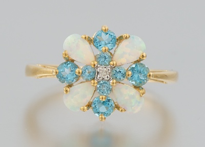 A Ladies' Opal and Blue Topaz Ring