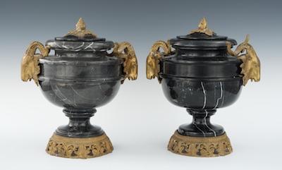 A Pair of Black Marble Urns with