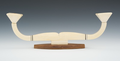A Wood and Ivory Candleholder A modernist