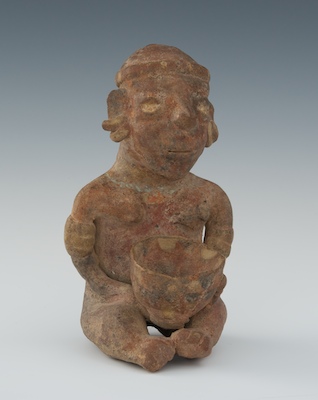 A Terracotta Seated Figure Red