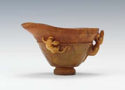 A Chinese Carved Horn Libation Cup Carved