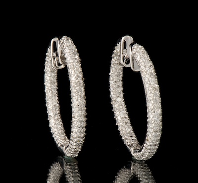 A Pair of Diamond Hoop Earrings 134579