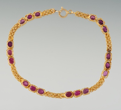 A Ladies Gold and Ruby Bracelet 13459d
