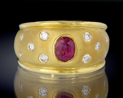 A Heavy 18k Gold Ring with Ruby