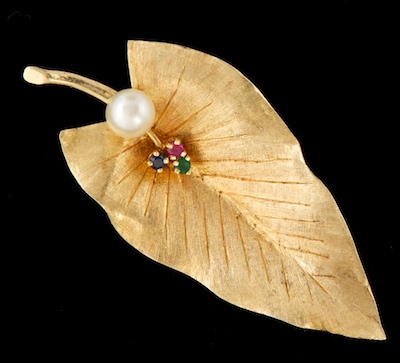 A Ladies' Gold and Gemstone Leaf
