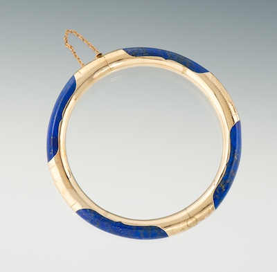 A Carved Lapis and Gold Bangle Bracelet