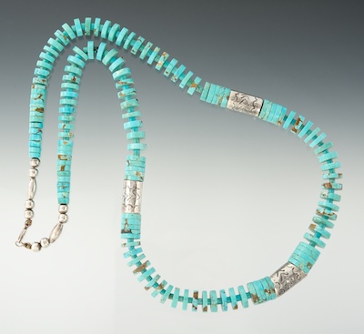 A Carved Turquoise and Sterling