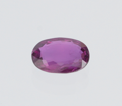 An Unmounted Ruby UGL Report Oval mixed