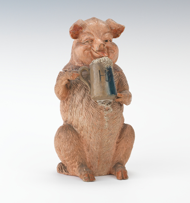 A Figural Tobacco Humidor of a Pig Holding