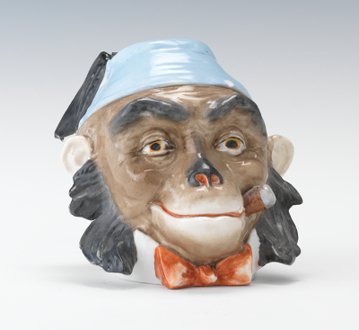 A Figural Cigar Smoking Monkey