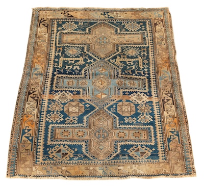 An Antique Caucasian Rug Tightly