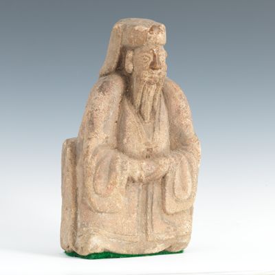 A Carved Stone Tomb Figure Seated