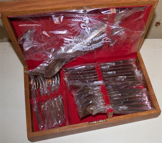 Silver-plated flatware set in wood