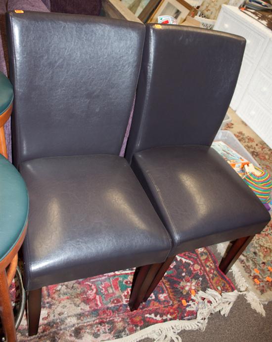 Pair of contemporary mahogany naugahyde