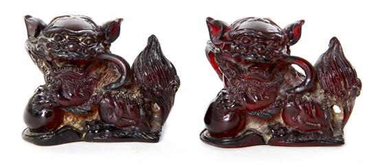 Chinese carved amber guardian lions