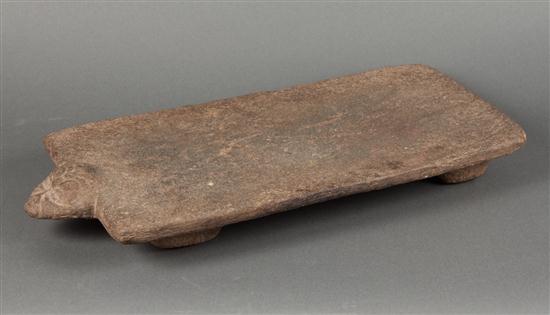 Precolumbian carved stone metate with