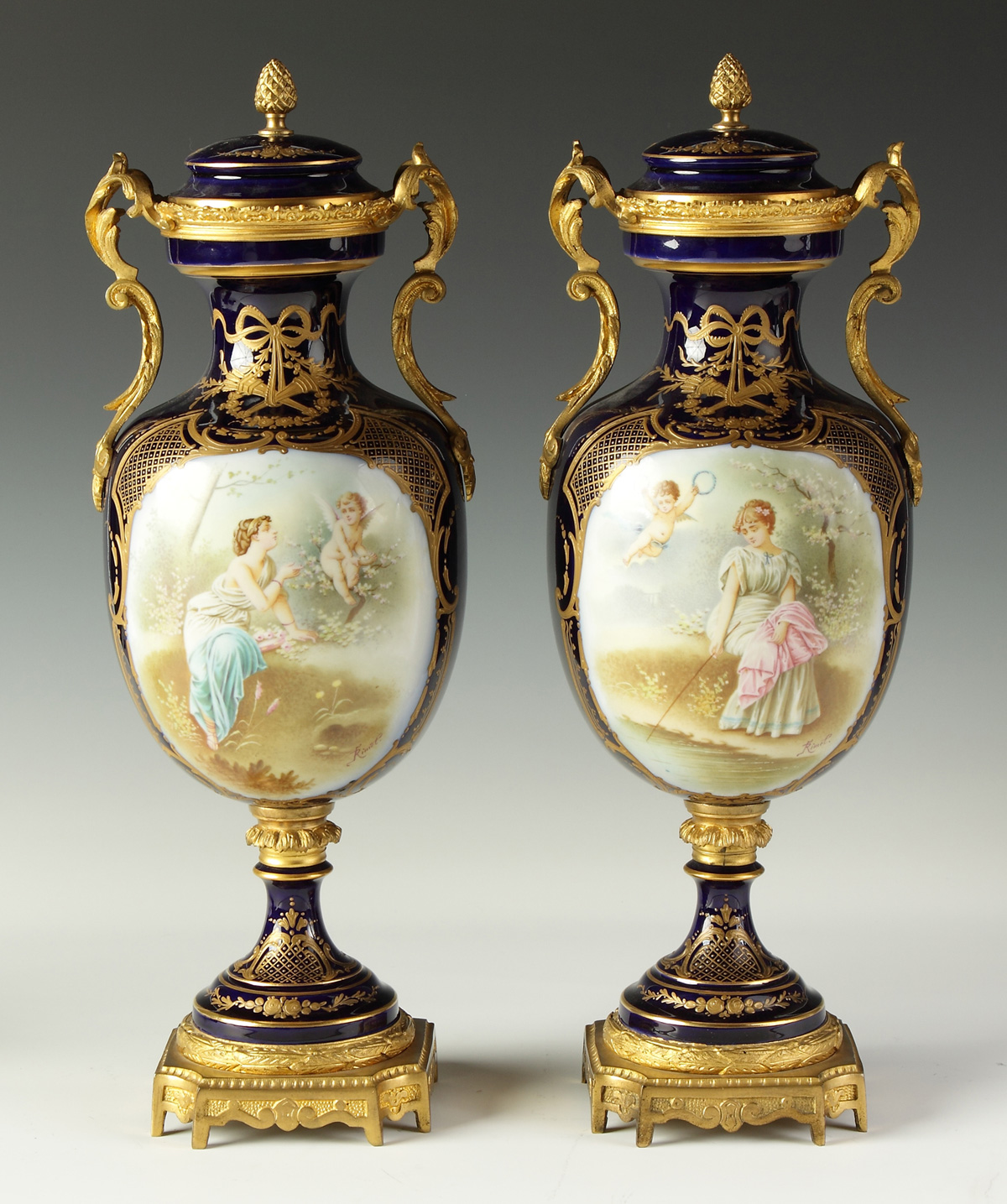 Pair of Sevres Covered Urns w/gilt