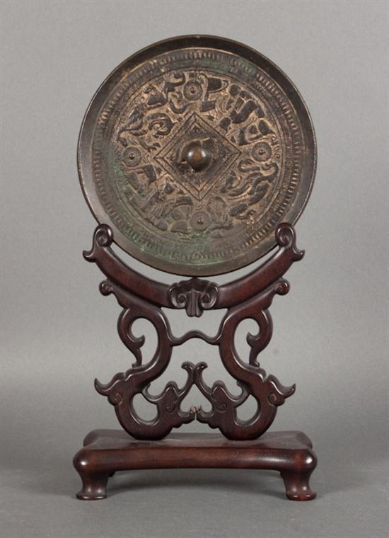 Chinese bronze hand mirror in the 1385ca