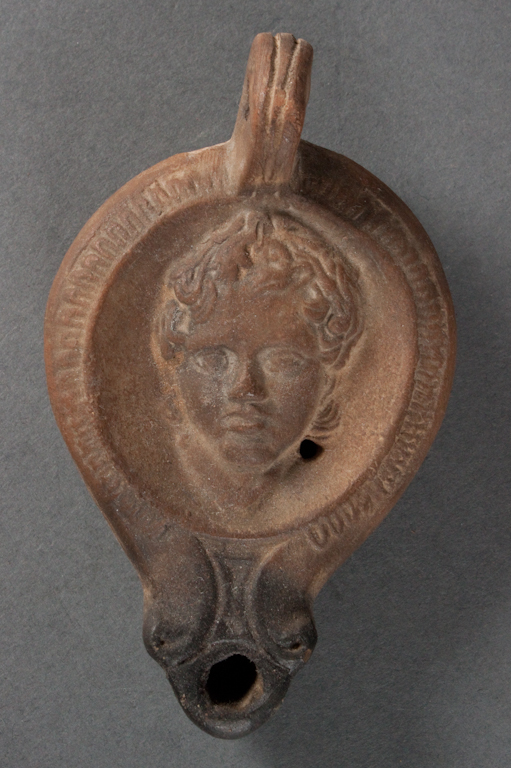 Roman molded terracotta oil lamp