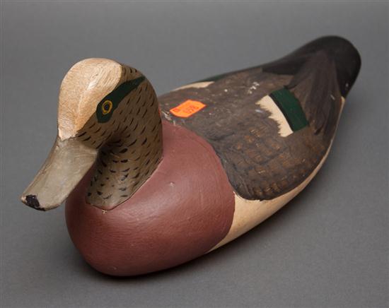 Carved and painted wood working duck