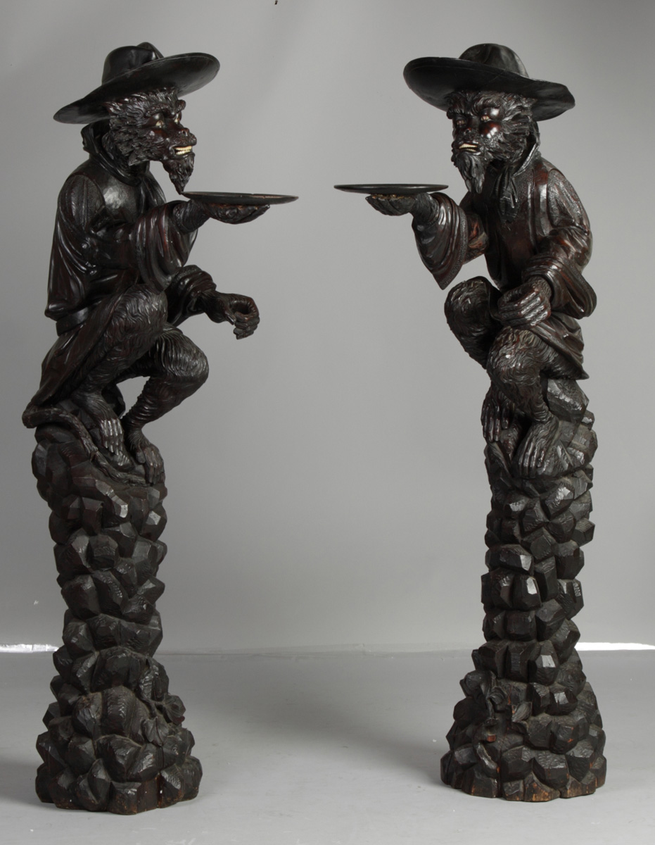 A Pair of Black Forest Carved Guard
