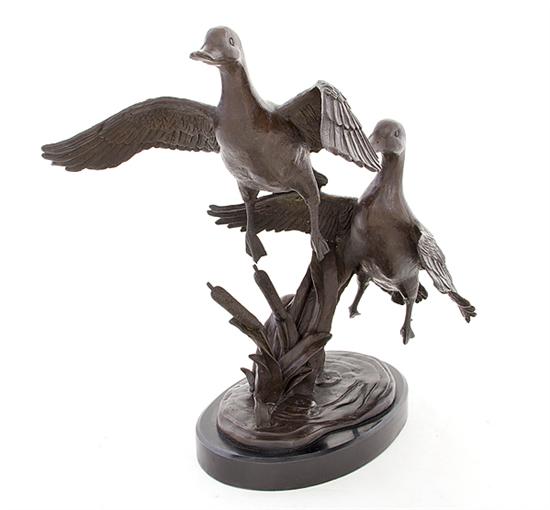 Bronze sculpture of rising ducks