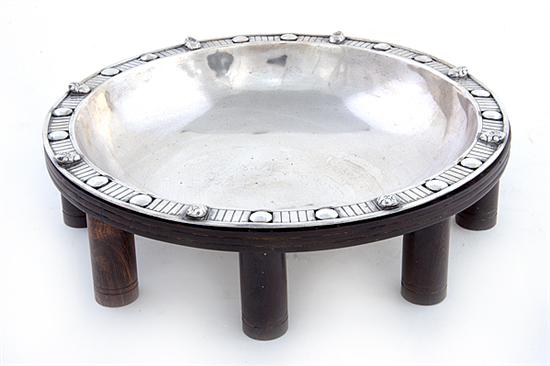 Silver metal centerbowl on wood 136b37