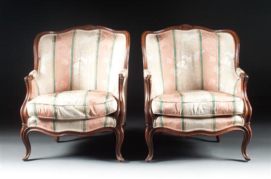 Pair of Louis XV style walnut upholstered