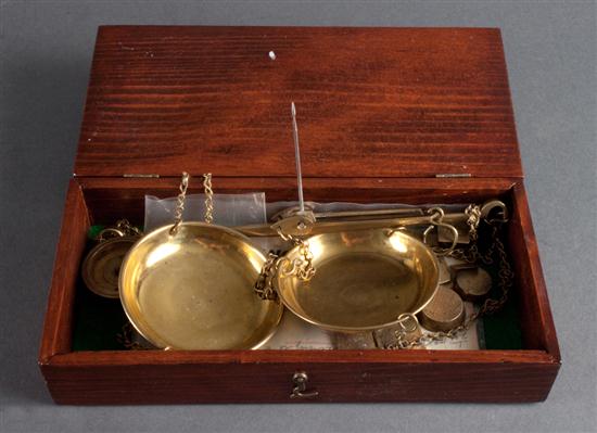 Brass jewelers scale with weights in