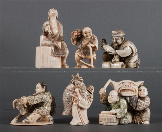 Six Japanese carved ivory and ink-highlighted