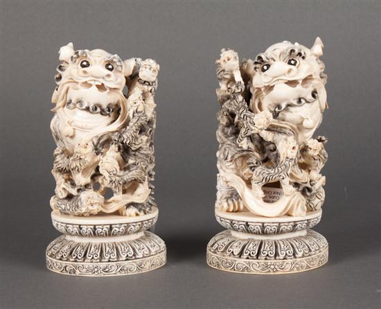 Pair of Chinese carved and ink-highlighted
