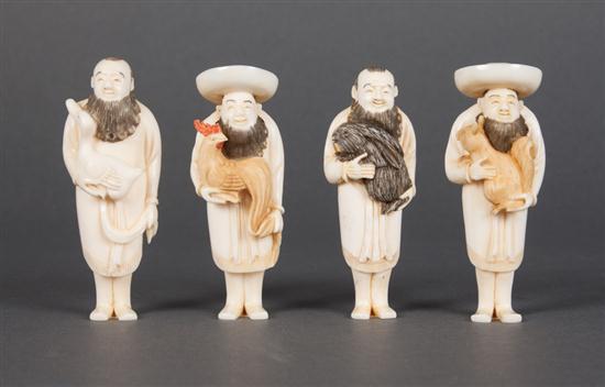 Four Japanese carved ivory figural