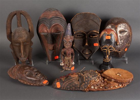 Six African carved wood masks and 139bce