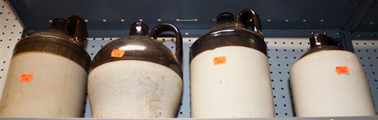Four brown and white stoneware jugs