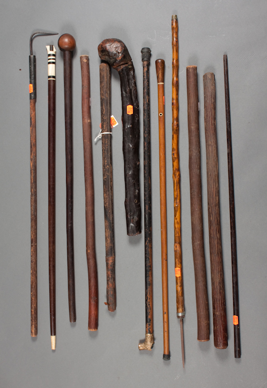 Selection of clubs canes and cane