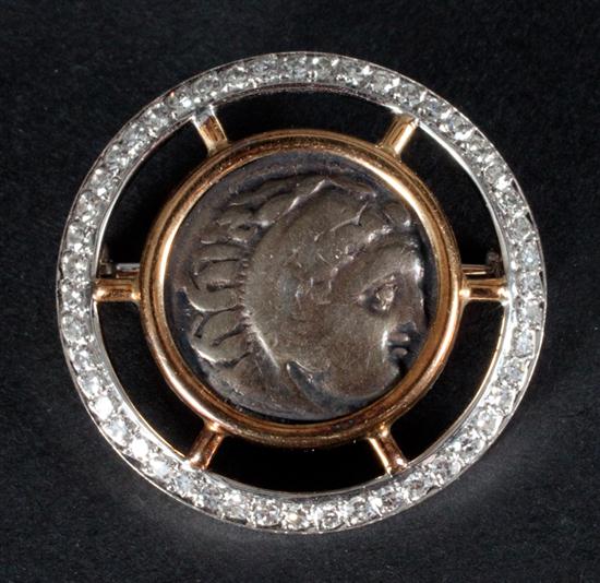 Greek silver coin mounted onto a gold