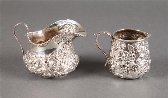 Two American repousse silver cream jugs