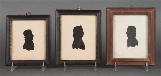 Three framed silhouettes of Thomas