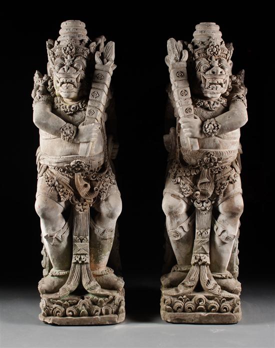 Pair of Balinese carved lava demon