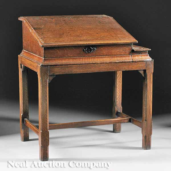 An Antique English Carved Oak Desk