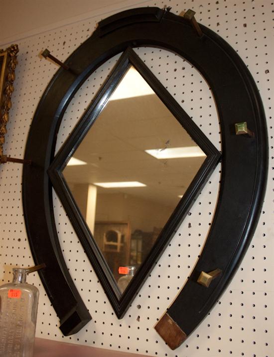 Ebonized wood horseshoe-form mirror