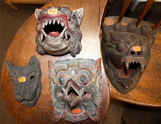Four Balinese polychrome wood masks