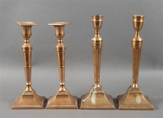 Two pairs of George III brass candlesticks 138aae