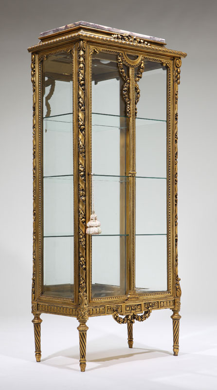 A Louis XVI style giltwood vitrine