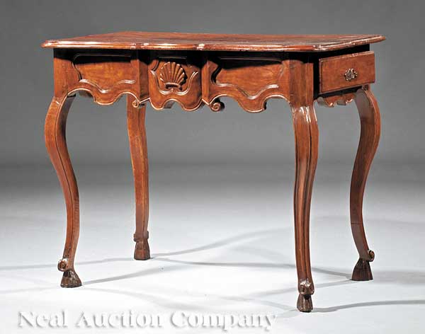 A Louis XV Provincial Carved Walnut