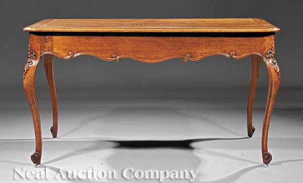 A French Provincial Carved Mahogany