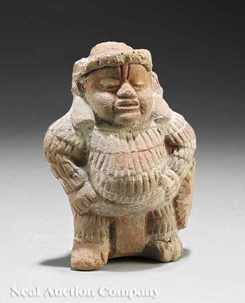 A Maya Pottery Figure of a Fat Man c.